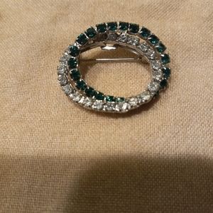 Vintage brooch with green and clear stones